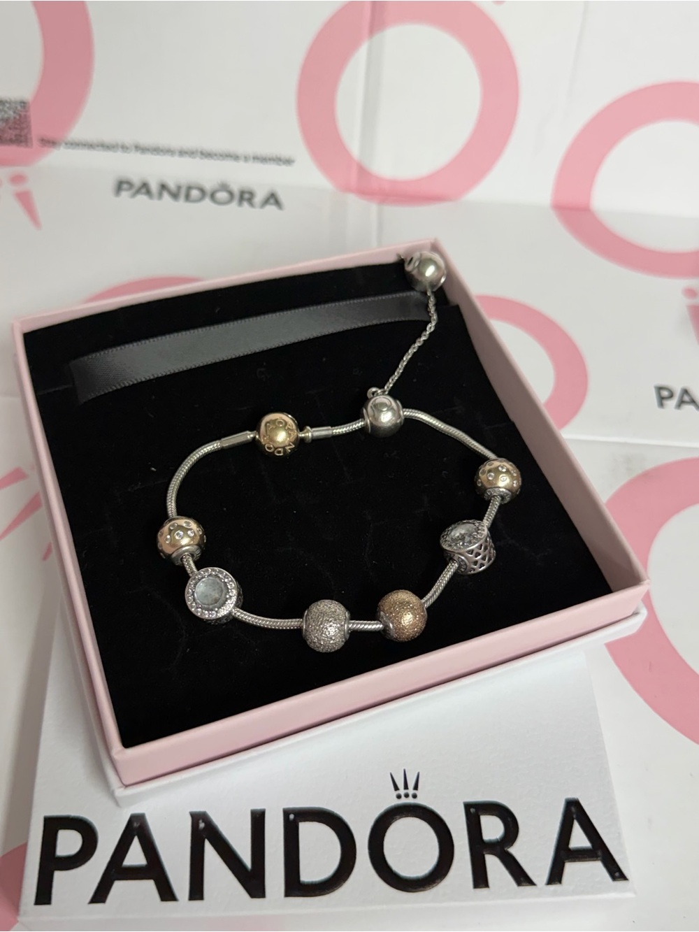 Pandora Essence bracelet with 14k silver and solid gold charms